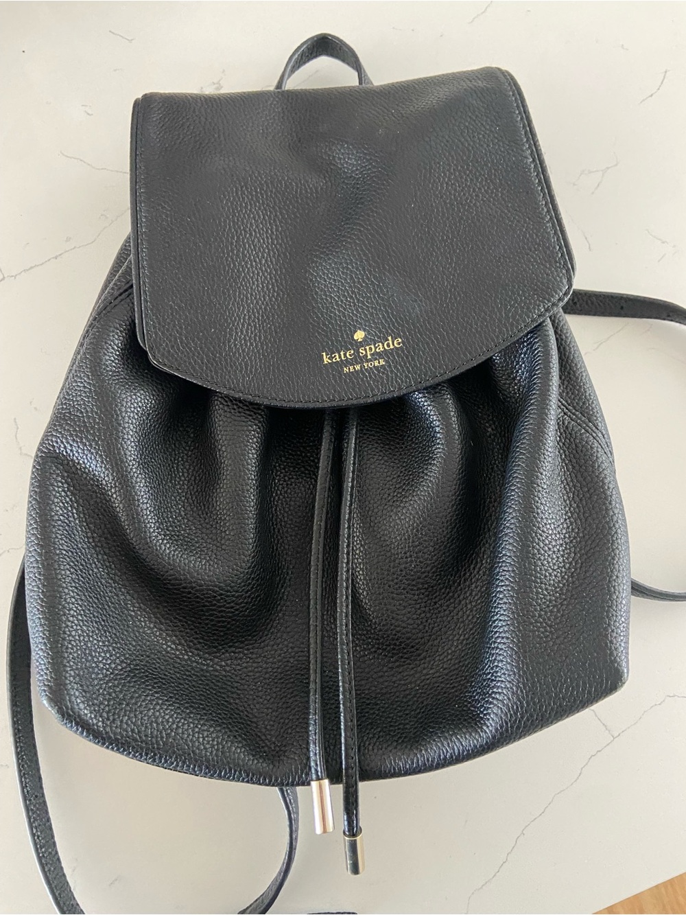 kate spade Black Pebbled Leather Drawstring Backpack with Gold Logo